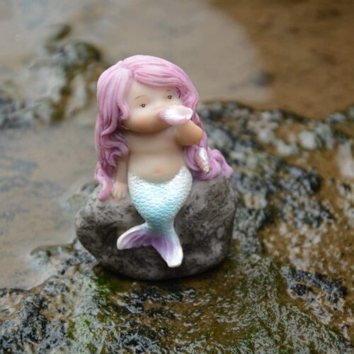 top collection miniature little mermaid playing with a shell